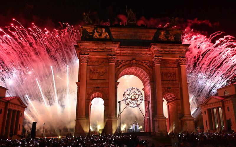 In Olympic first, twin flames kick-off Italy’s winter games after glitzy ceremony