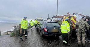 Emergency services called to beach after suspected explosive found