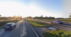 Delays on A47 after vehicle crashes into field