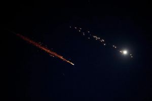 Woman injured from flying debris in central Israel as Iran keeps up missile fire