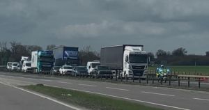 Man detained after rolling road block on A11