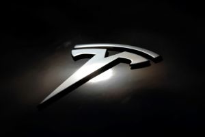 Tesla Shares Slide Nearly 2% in Volatile Trading, Hovering Around $389 Amid Regulatory Deadline