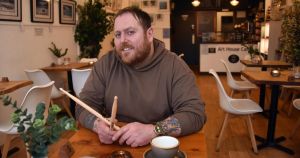 Meet the man who is a café owner by day and thrash metal band drummer by night