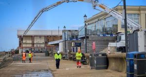 Giant machine starts pumping concrete to fill 'bus-sized' hole under prom