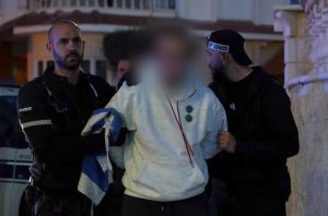 Ben Gvir rides with Lod police as they nab man for Palestinian flag graffiti on city hall