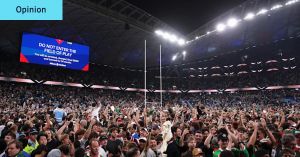 Thousands of fans ran onto the field when Johnston broke the try-scoring record. The PM and I were two of them