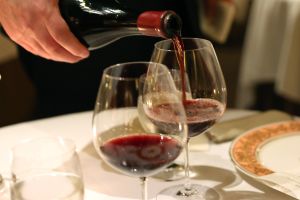 Drinking red wine increases your risk of getting cancer. Warning labels should say so