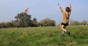 Nearly 200 people take part in meadow kite-flying event