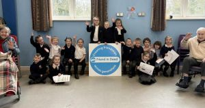 Care home residents and school pupils enjoy singing session
