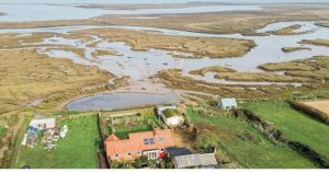 Cottage with 'panoramic' sea views and boathouse on the market