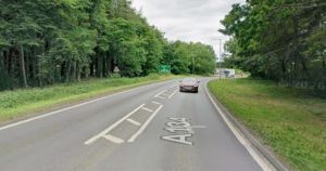 Two in hospital after crash closes road