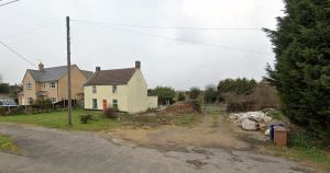 Plans for four 'cramped' homes in riverside village turned down