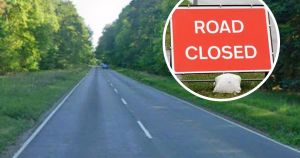 Car fire closes busy road