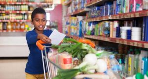 Man takes group of boys grocery shopping, teaching them to use their best instincts to be helpful