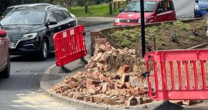 Lorry smashes into wall on tight bend