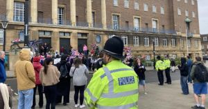 Protestors clash with heckling left-wing supporters at City Hall
