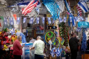 Restrictions lifted, but war clouds put damper on Independence Day plans