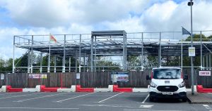 Progress update on major designer discount store due to open this year