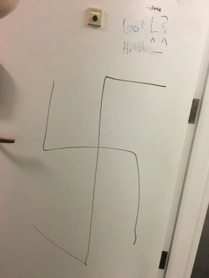 Long Island father and teenage son arrested as cops probe swastika in school bathroom