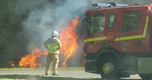 Car fire blocks major road