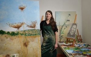 Artist from war-torn north relocates to Tel Aviv, discovers success with works of kibbutz views