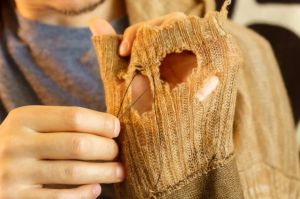 It’s just sweater holes being mended by hand, but people can’t look away