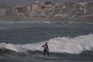Surfers in war-torn Gaza find rare moments of relief taking to the waves