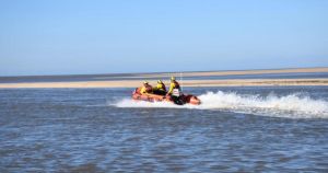 Lifeboat rescues two people and dog stranded by tide