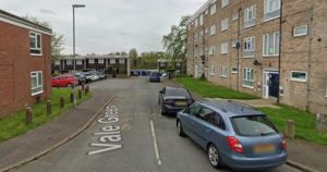 Suspect at large after woman found injured in street