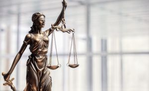 Lady Justice: the scales, the blindfold and .... the social media post
