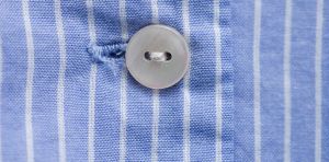 Why are buttons and zippers on different sides of men’s and women’s clothes?
