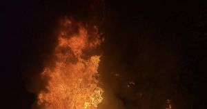 Fly tipped rubbish set alight in quiet village