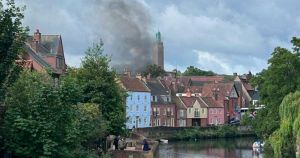 Huge plumes of smoke billow across Norwich due to fire near historic street