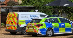Man found dead in village after forensic investigators spotted outside pub