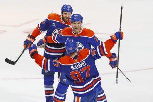 ‘Build Stan Bowman a statue’: Oilers fans react to Darnell Nurse, Devon Levi trades