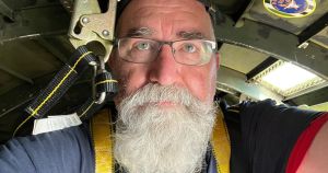 Standing at the door of an 83-year-old C-47 warplane above Niagara