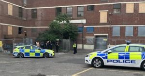 Police swarm abandoned building after teenagers spotted on roof