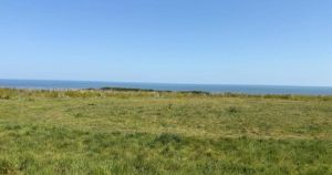 Land of former campsite with sea views and outbuildings going under the hammer