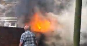 Watch: Huge plume of smoke fills street as garden bin bursts into flames