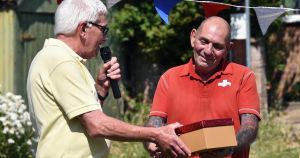 Much-loved postie given heartfelt send-off after delivering final letter
