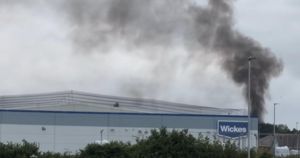 Fire breaks out in woodland near retail park
