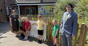 Pupils help turn soaked schoolyard into dry space after rain garden makeover