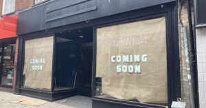'Coming soon' signs appear in window of recently closed city shop