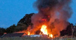 Shocking photos show inferno ripping through workshop in family’s yard