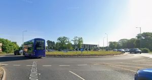 Delays at major roundabout after bus and car crash