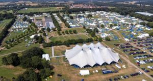 Why are 10,000 teens camping on the outskirts of Norwich this week?