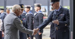 King given pot of honey during visit to Norfolk stealth fighter base