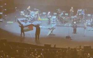 Singapore bans 2 members of Brit band Massive Attack for waving Palestinian flag at concert
