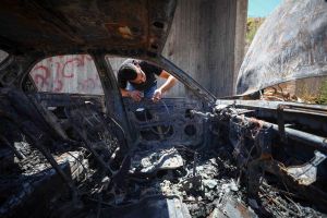 Settlers assault Palestinians, burn cars in overnight West Bank raid; no arrests
