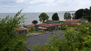 Panoramaudsigt over Vejle Fjord og egen strand: Her er de 10 dyreste sommerhuse ...